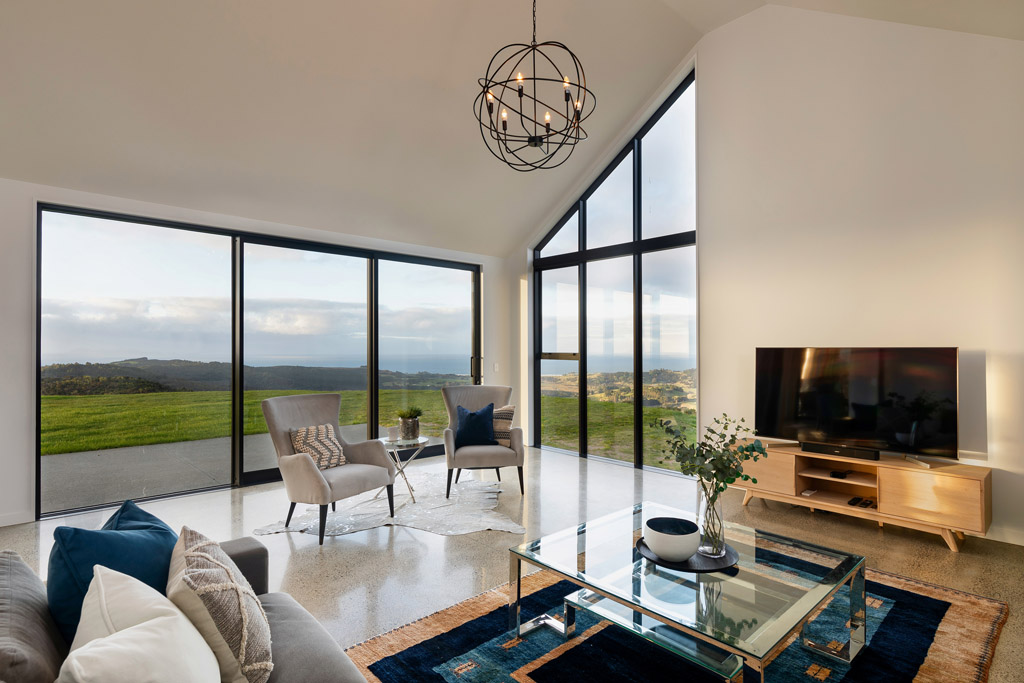 Modern indoor-outdoor living space with large windows